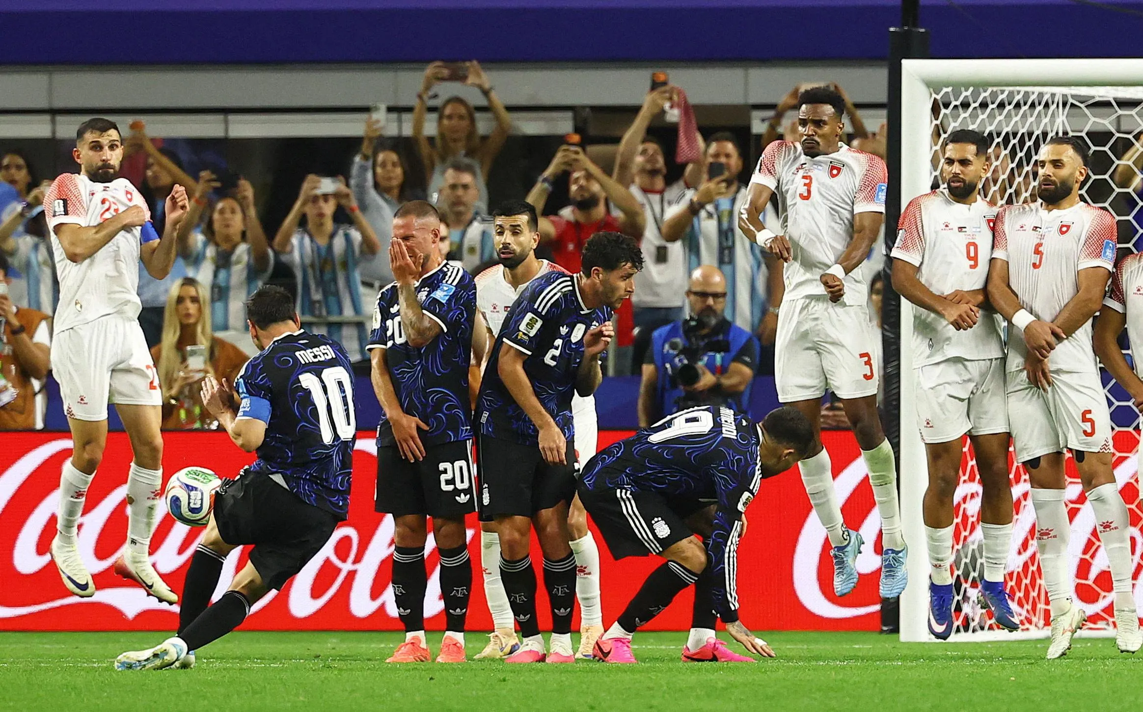 Lionel Messi curls his free-kick towards goal
