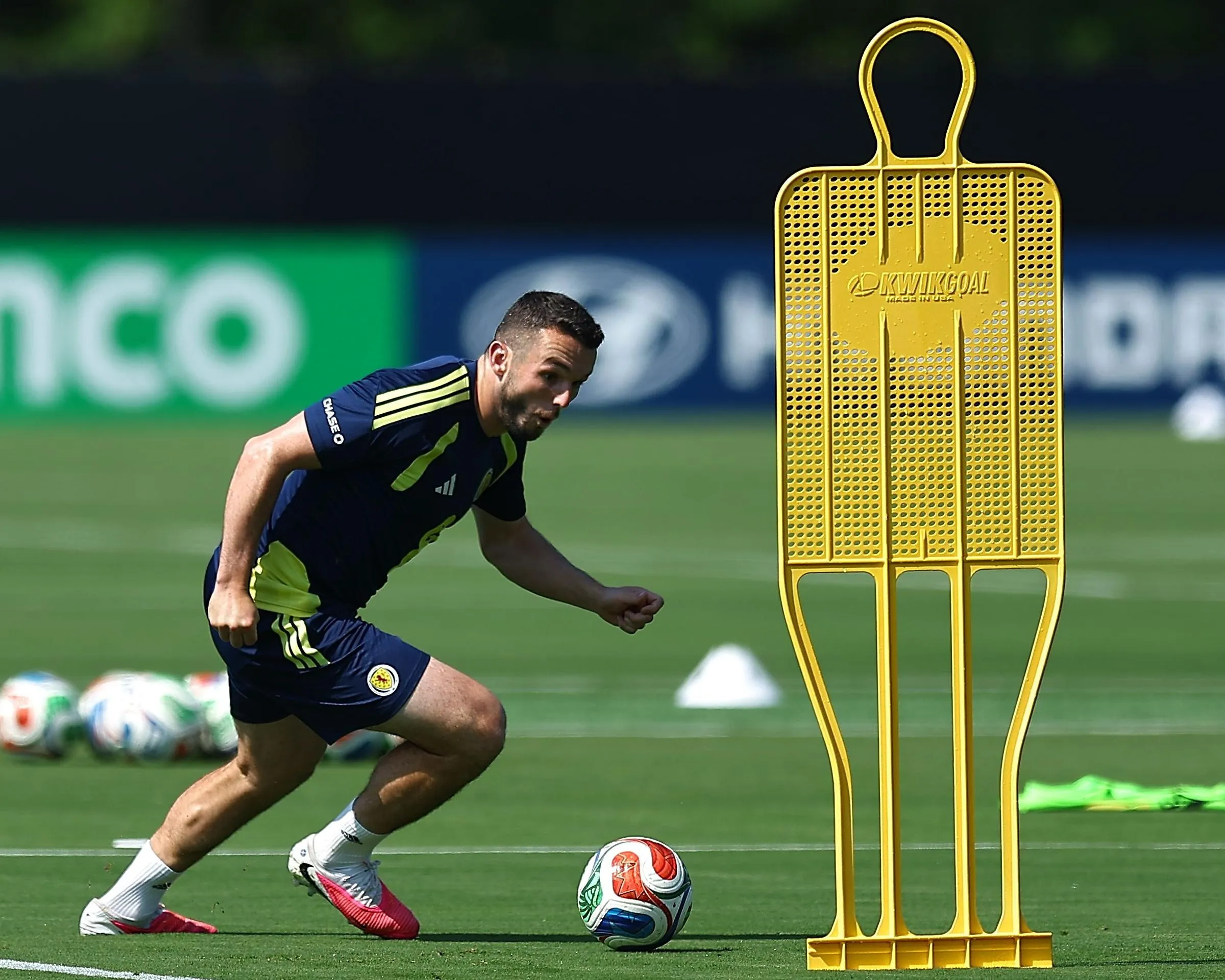 John McGinn goes past a wall dummy during a Scotland  training session.