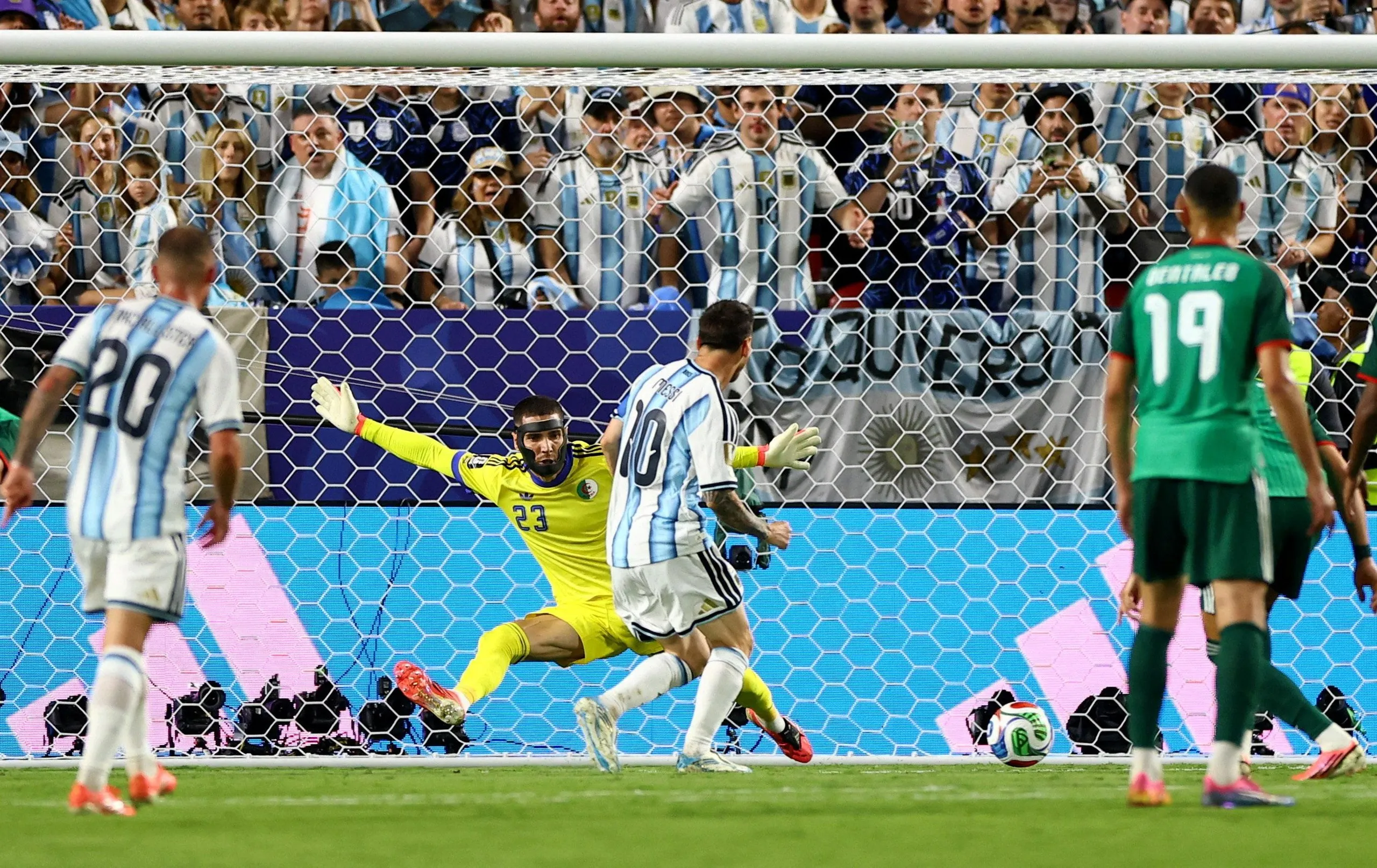 Lionel Messi scores his second goal.