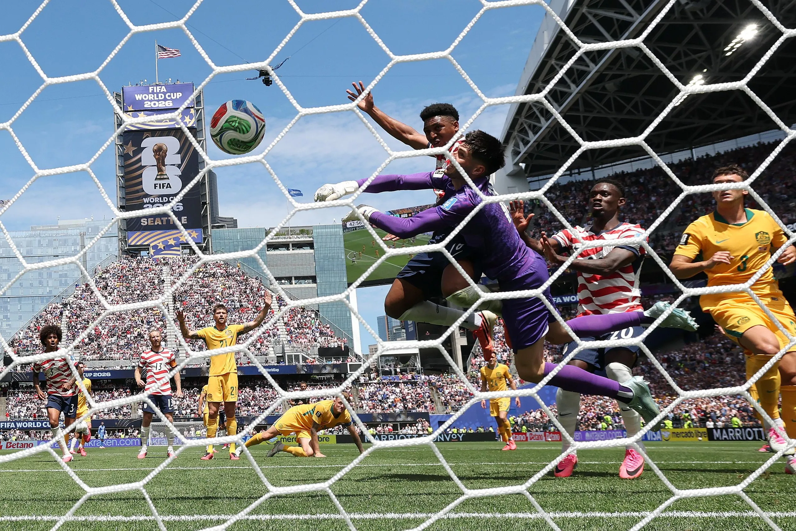 Alex Freeman scores a header