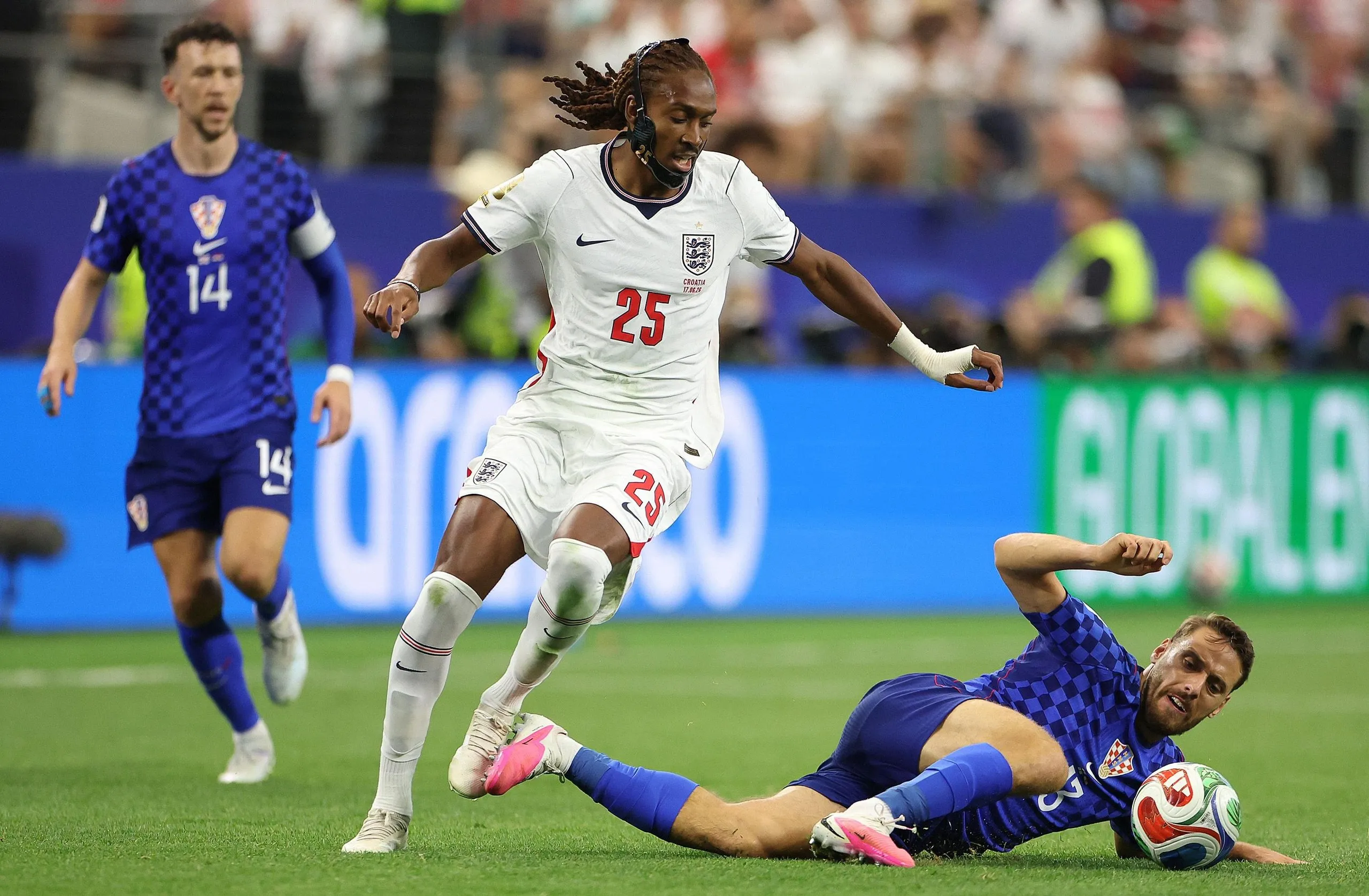 Croatia’s Nikola Vlasic competes with England’s Djed Spence