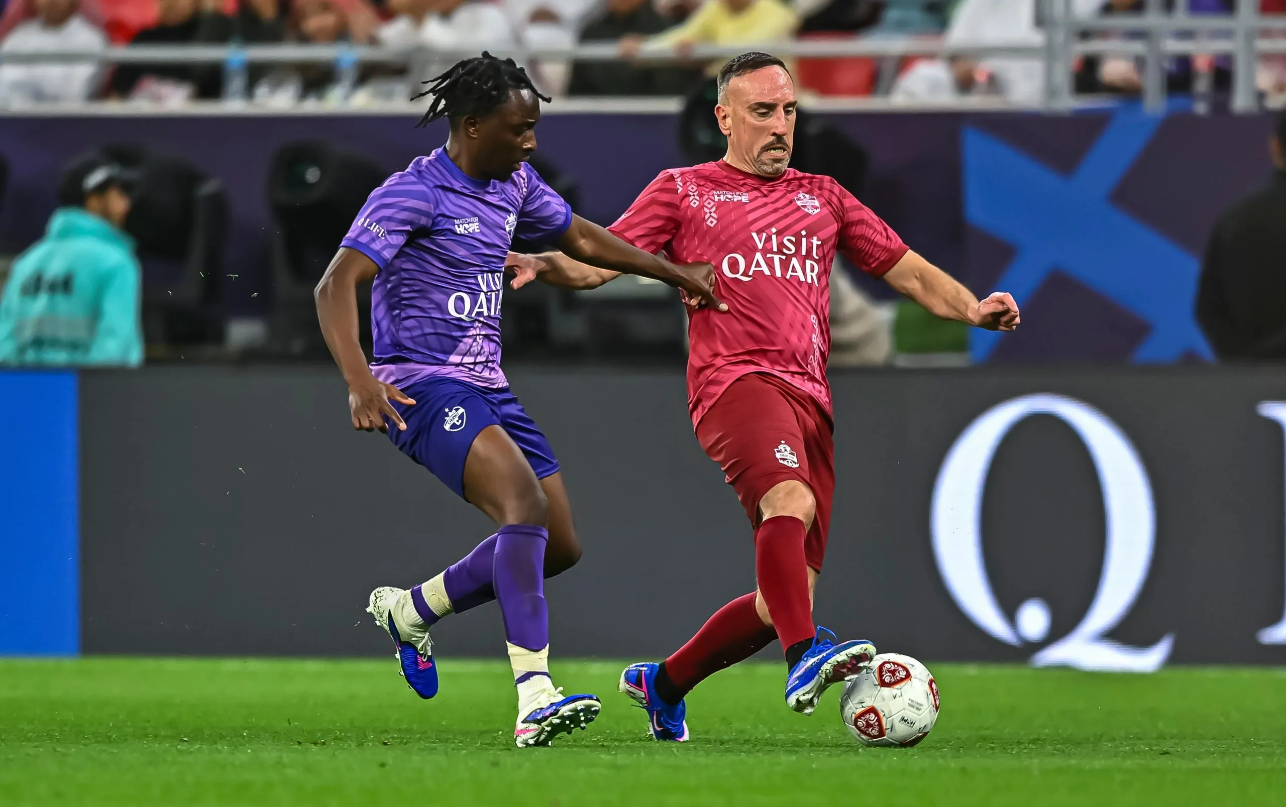 Manny Brown playing in a charity match with Franck Ribéry