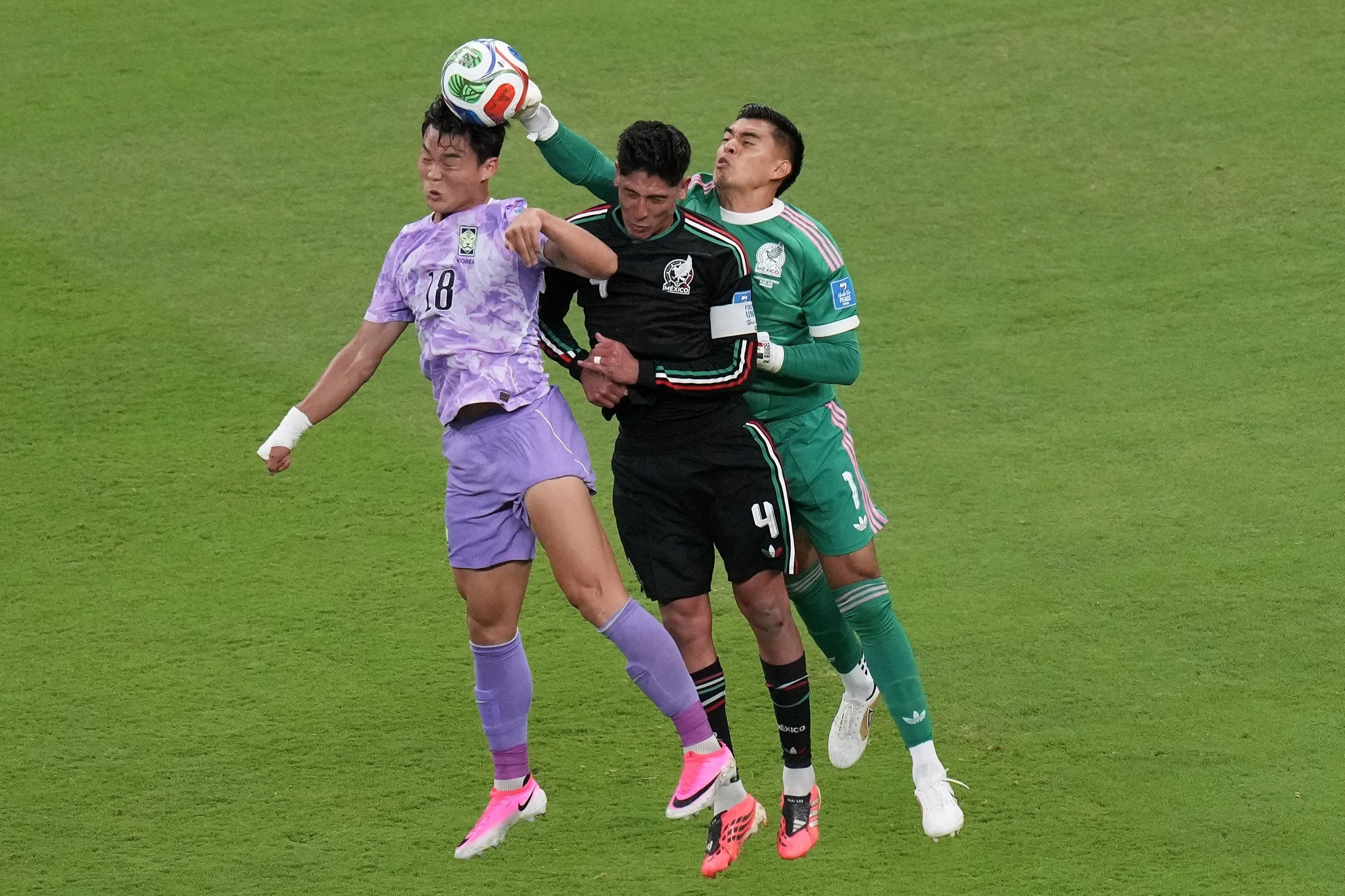 Mexico’s goalkeeper Raul Rangel (pictured right) reaches for the ball next to teammate Edson Álvarez (4) and South Korea’s Oh Hyeon-gyu (left)