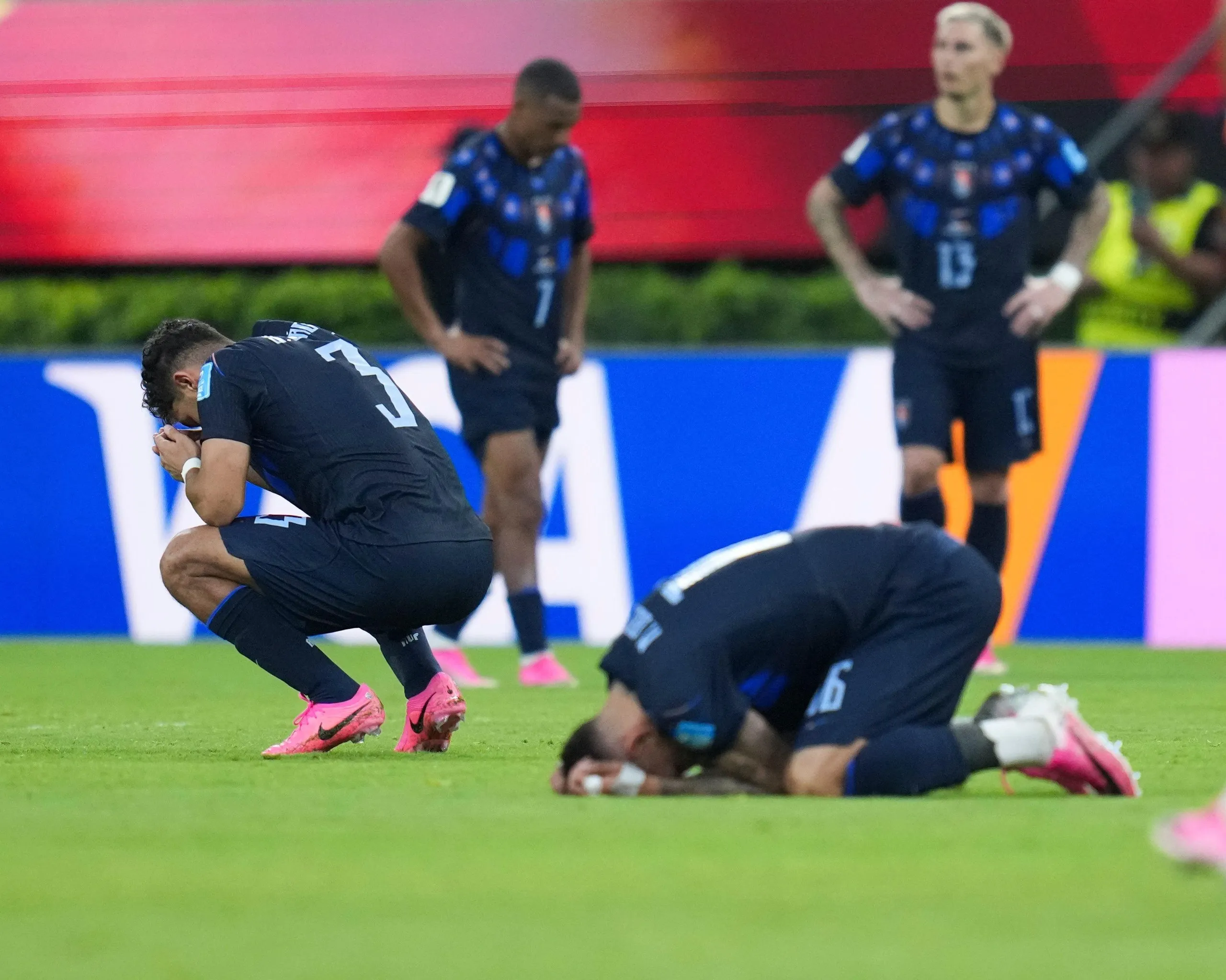 Uruguay players react after defeat to Spain.
