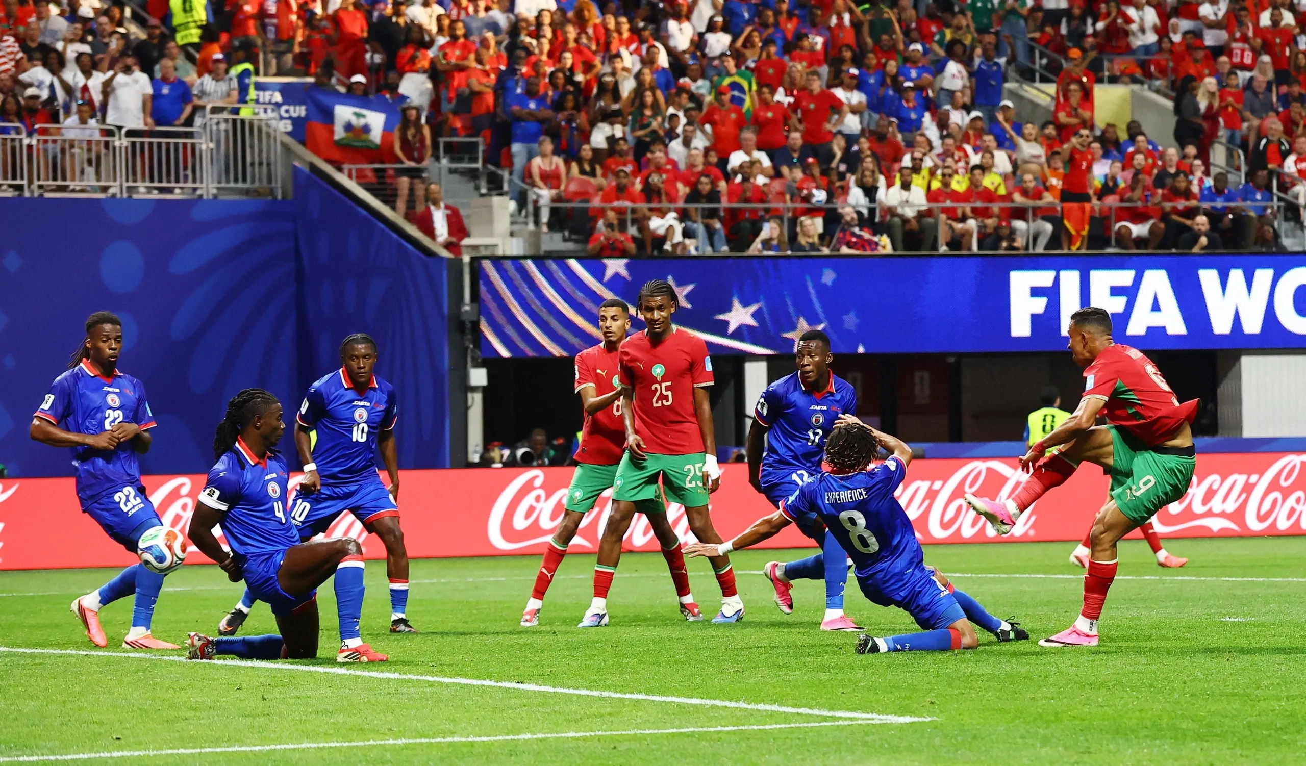 Soufiane Rahimi scores their third goal past Haiti's Johny Placide