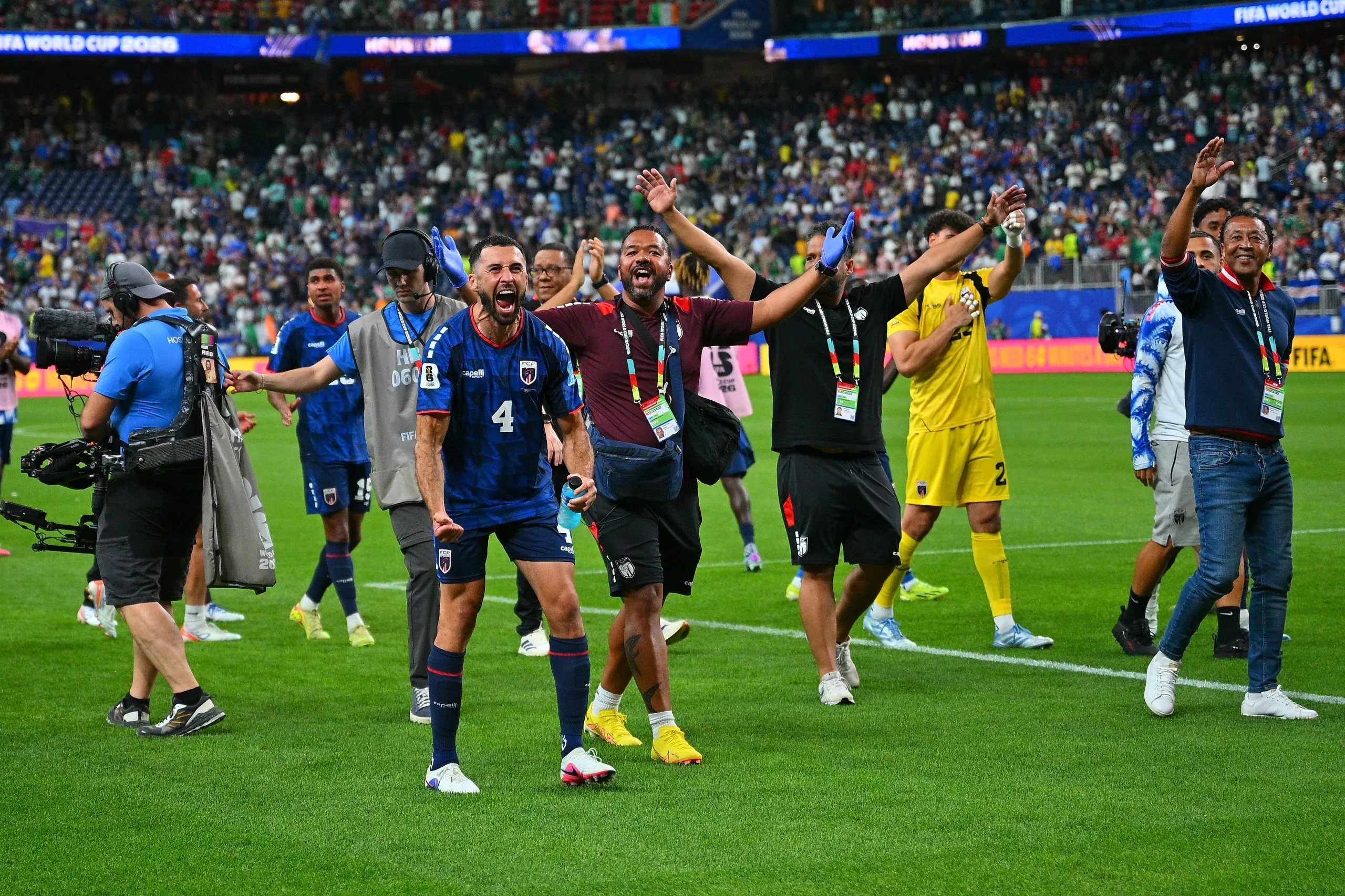 Roberto Lopes of Cape Verde celebrates with fans after the team qualified