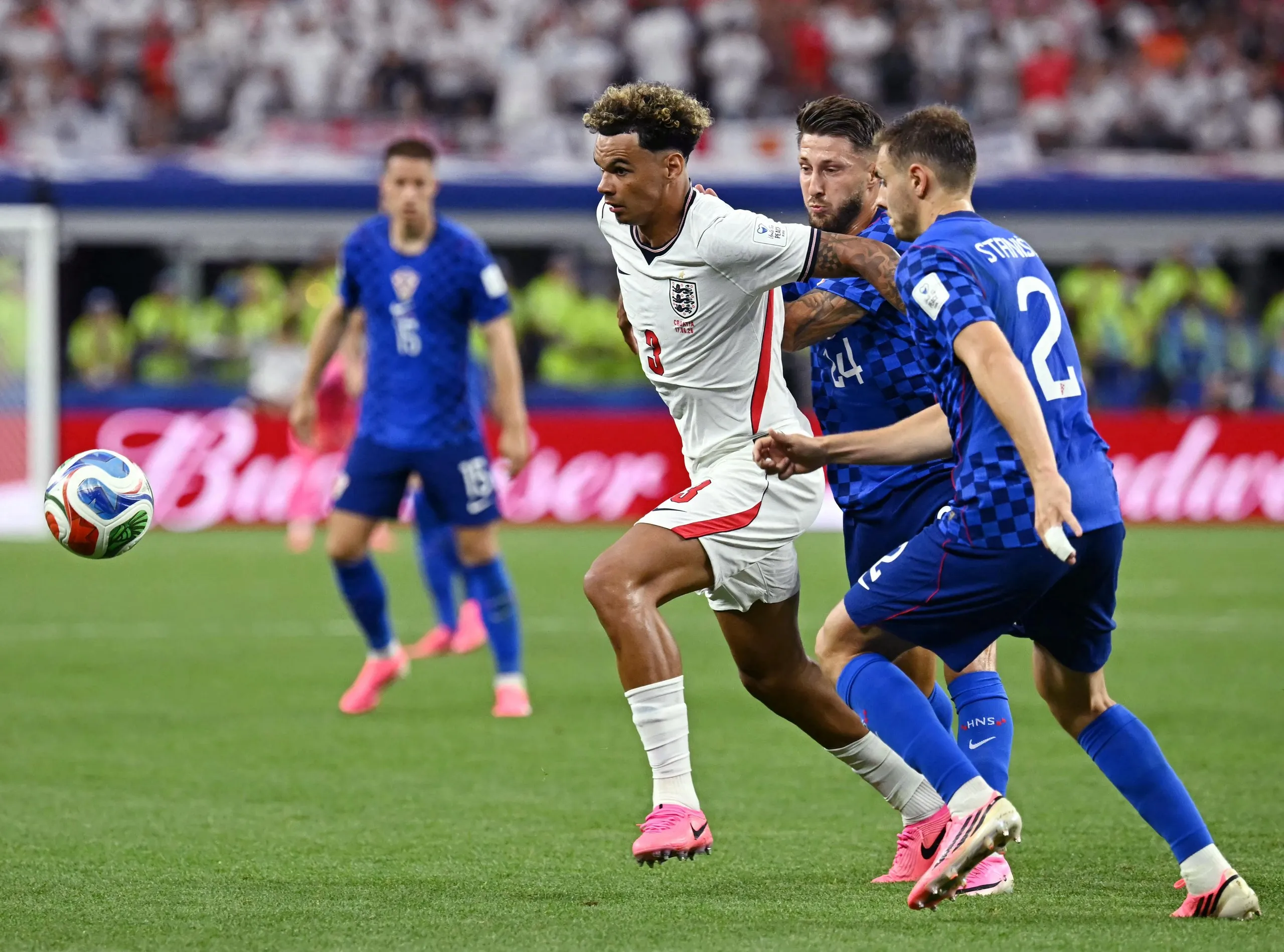 Nico O’Reilly (centre) vies for the ball with two Croatia players