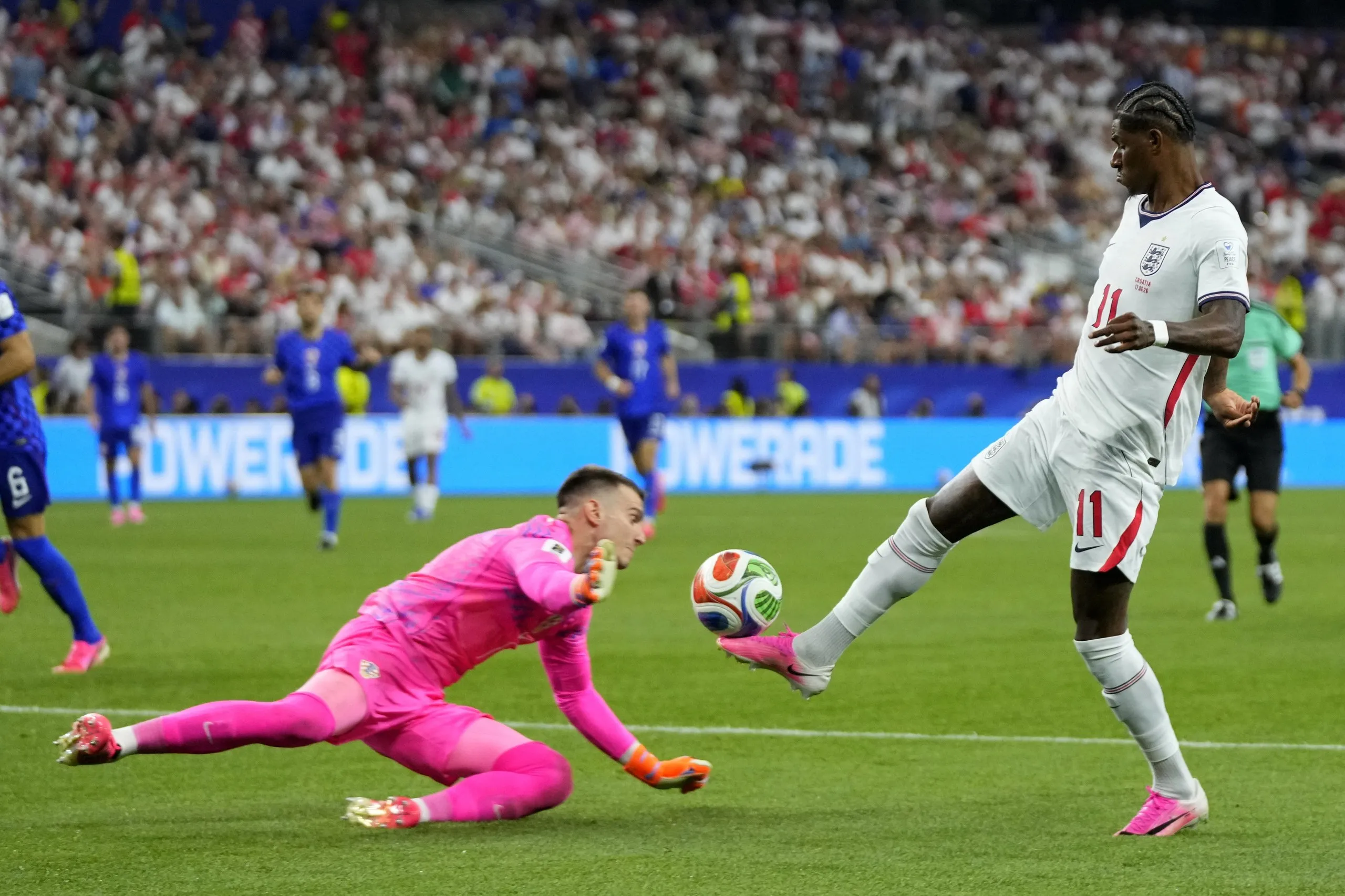 The Croatia goalkeeper Dominik Livakovic denies Marcus Rashford