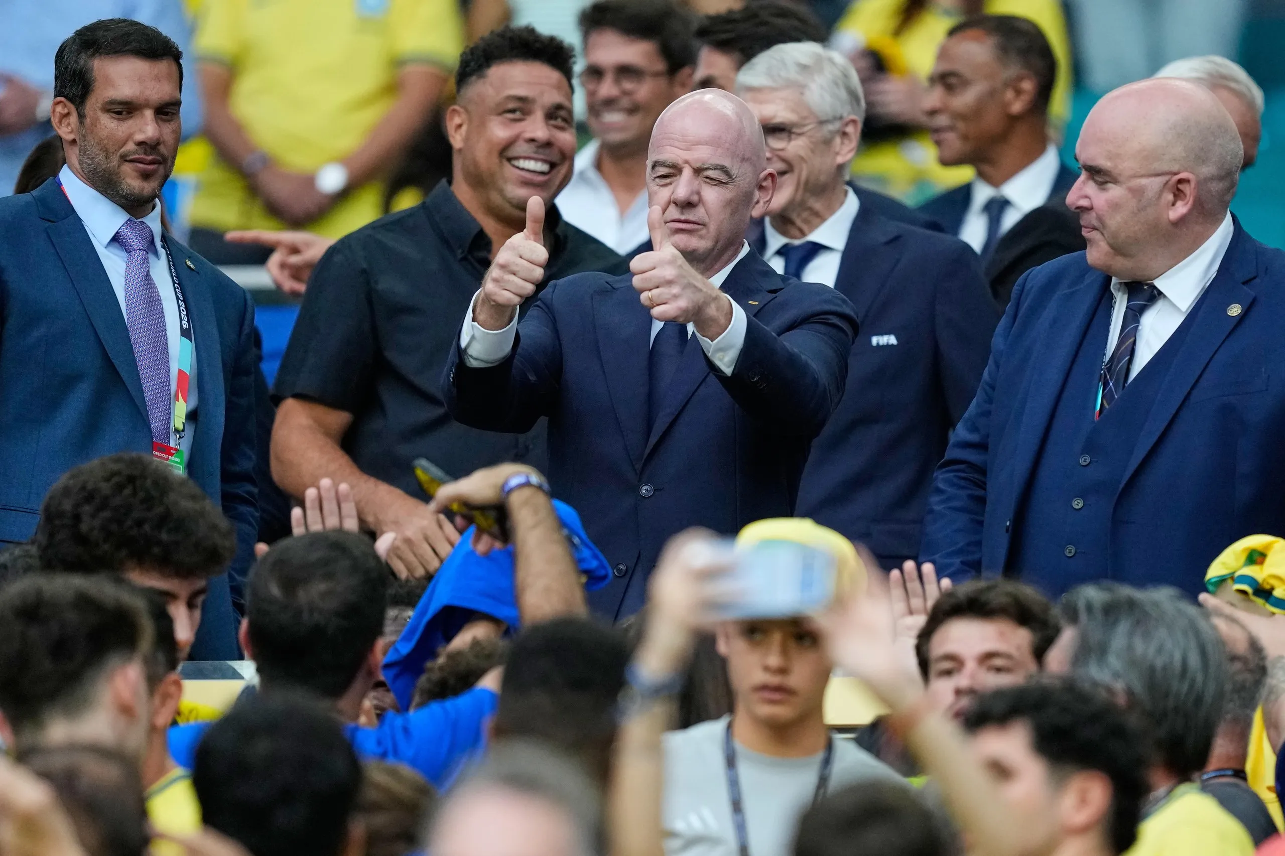 Gianni Infantino gives a double thumbs-up.