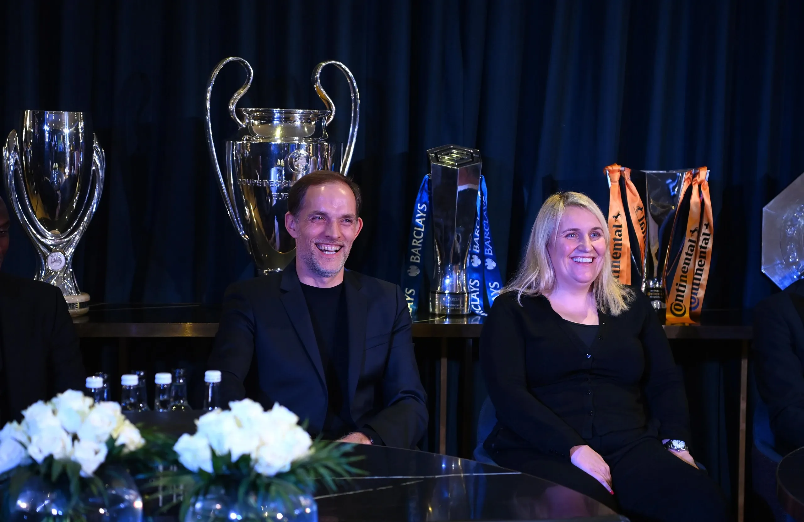 Thomas Tuchel and Emma Hayes in 2021, with trophies on display behind them