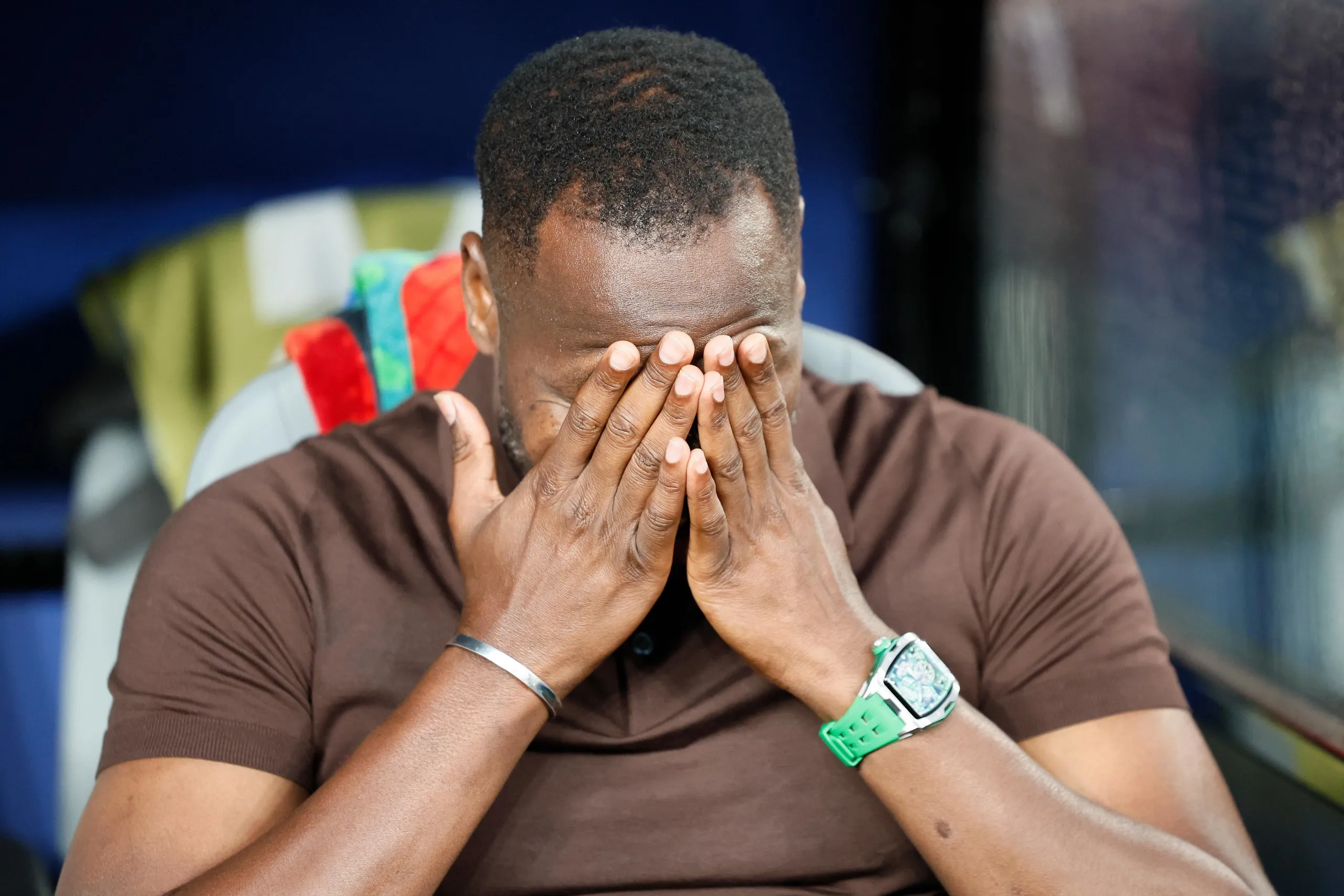 Pape Thiaw puts his head in his hands.