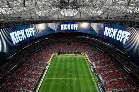 An aerial view of Mercedes-Benz Stadium with “Kick Off” displayed on video boards.