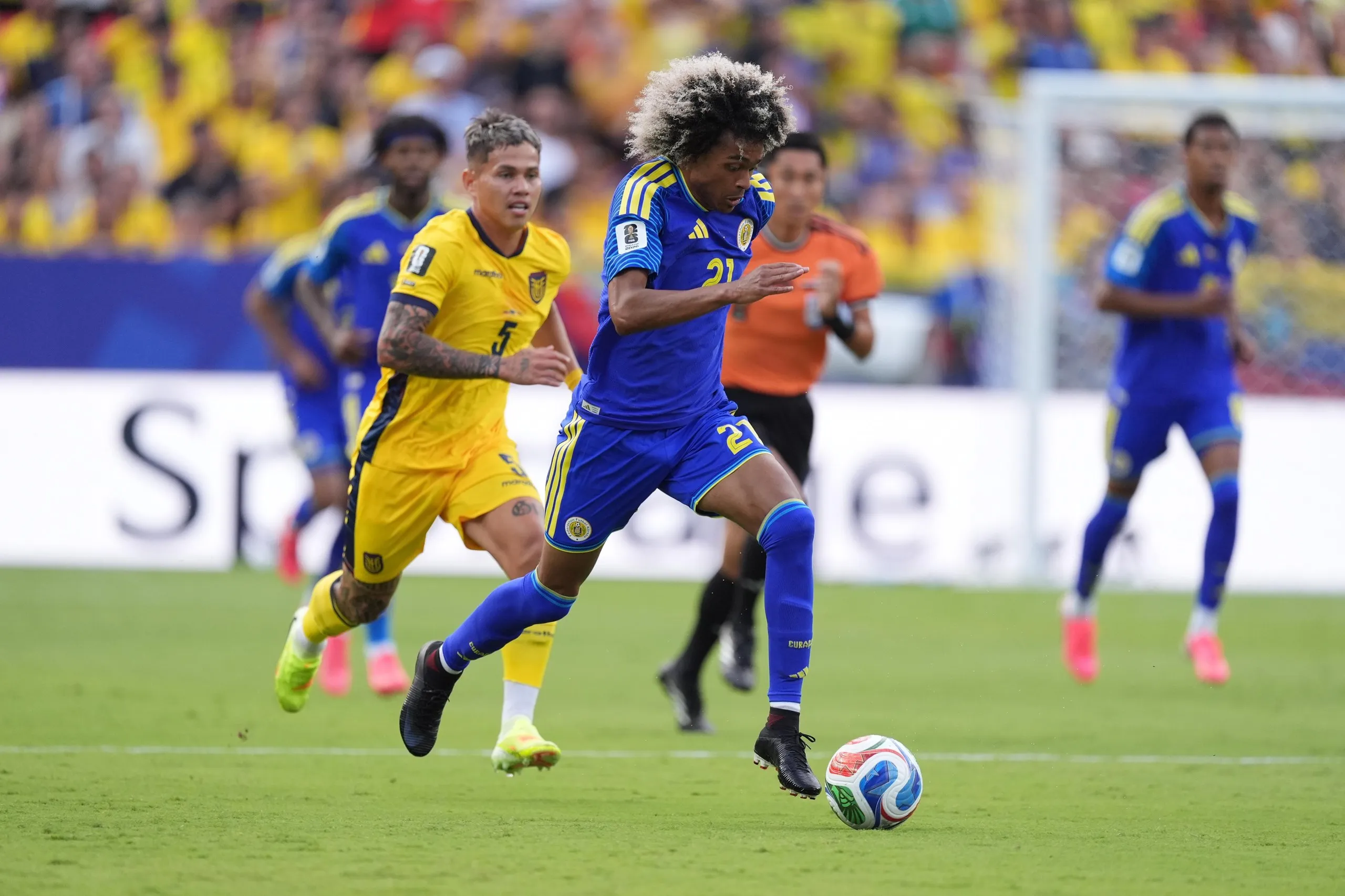 Tahith Chong runs with the ball