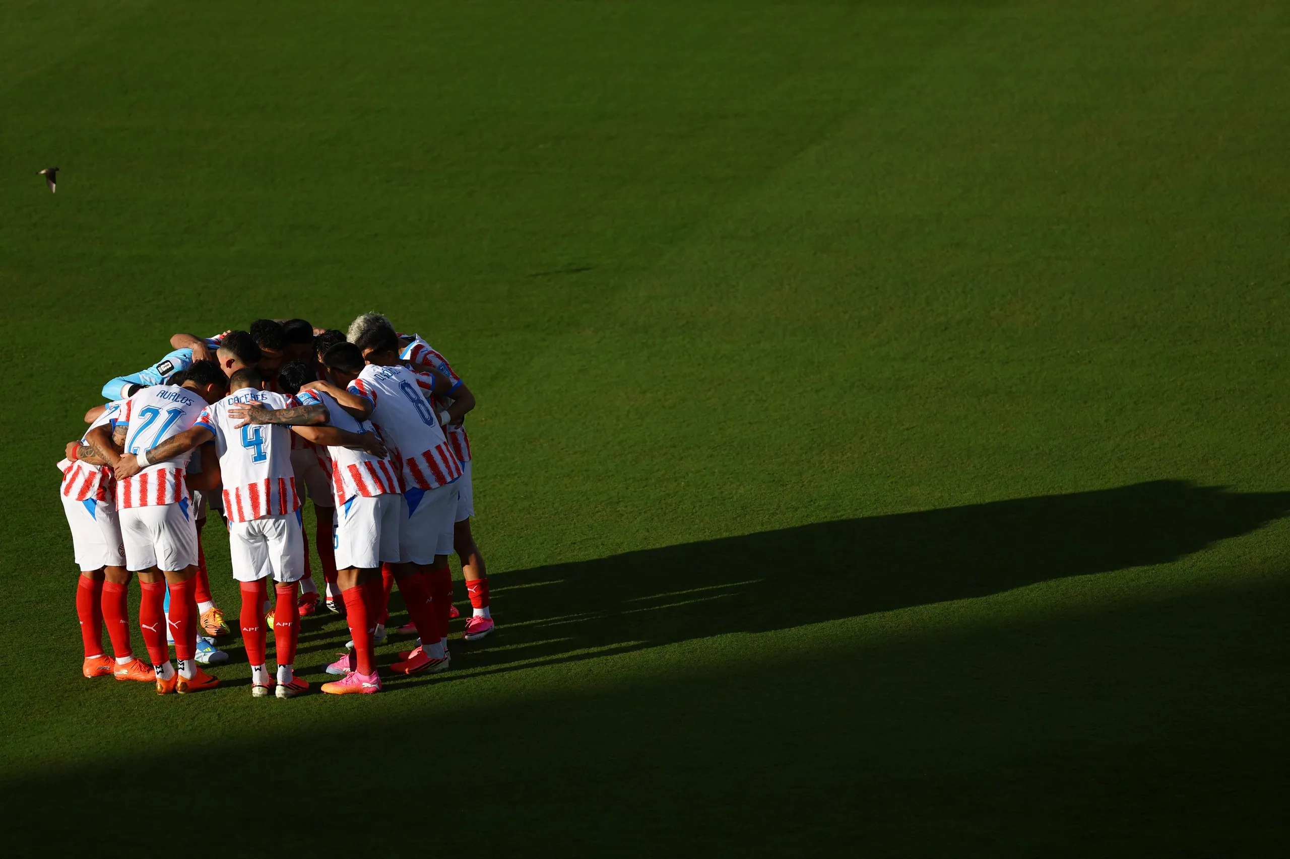 General view as Paraguay players huddle before the match