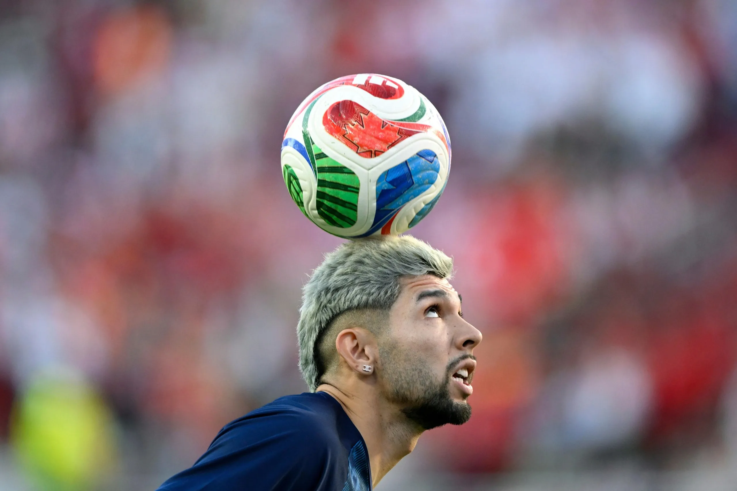 Paraguay's Julio Enciso (19) warms up today