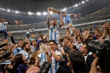 Argentina’s Lionel Messi holds up the World Cup at Lusail Stadium in Doha