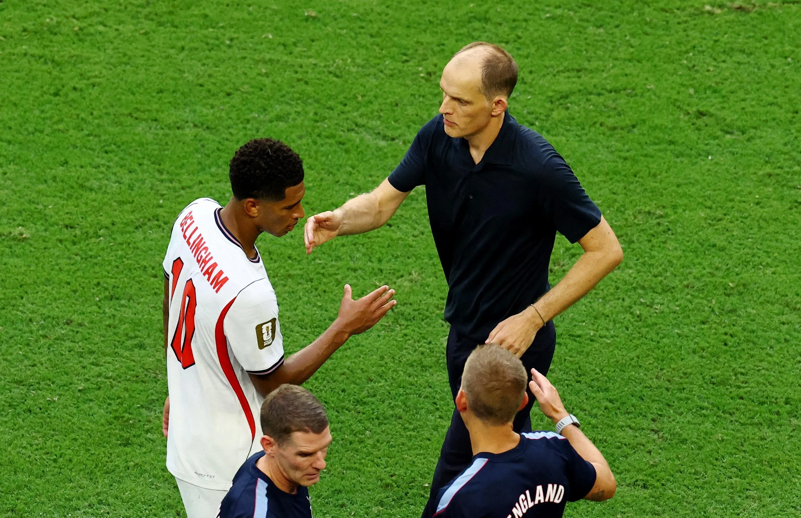Thomas Tuchel goes to shake hands with Jude Bellingham as he is substituted against Norway.