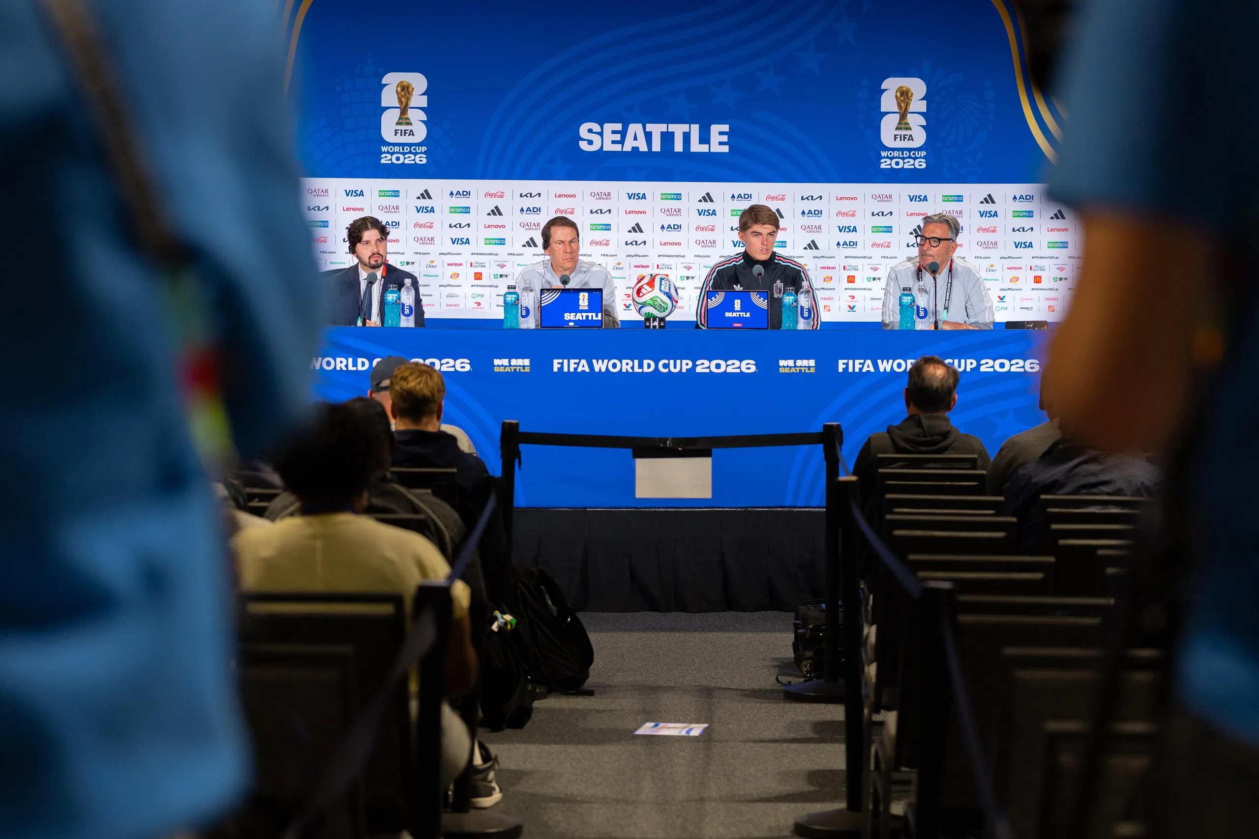 Rudi Garcia (second left) and Charles De Ketelaere (second right) face the press in Seattle