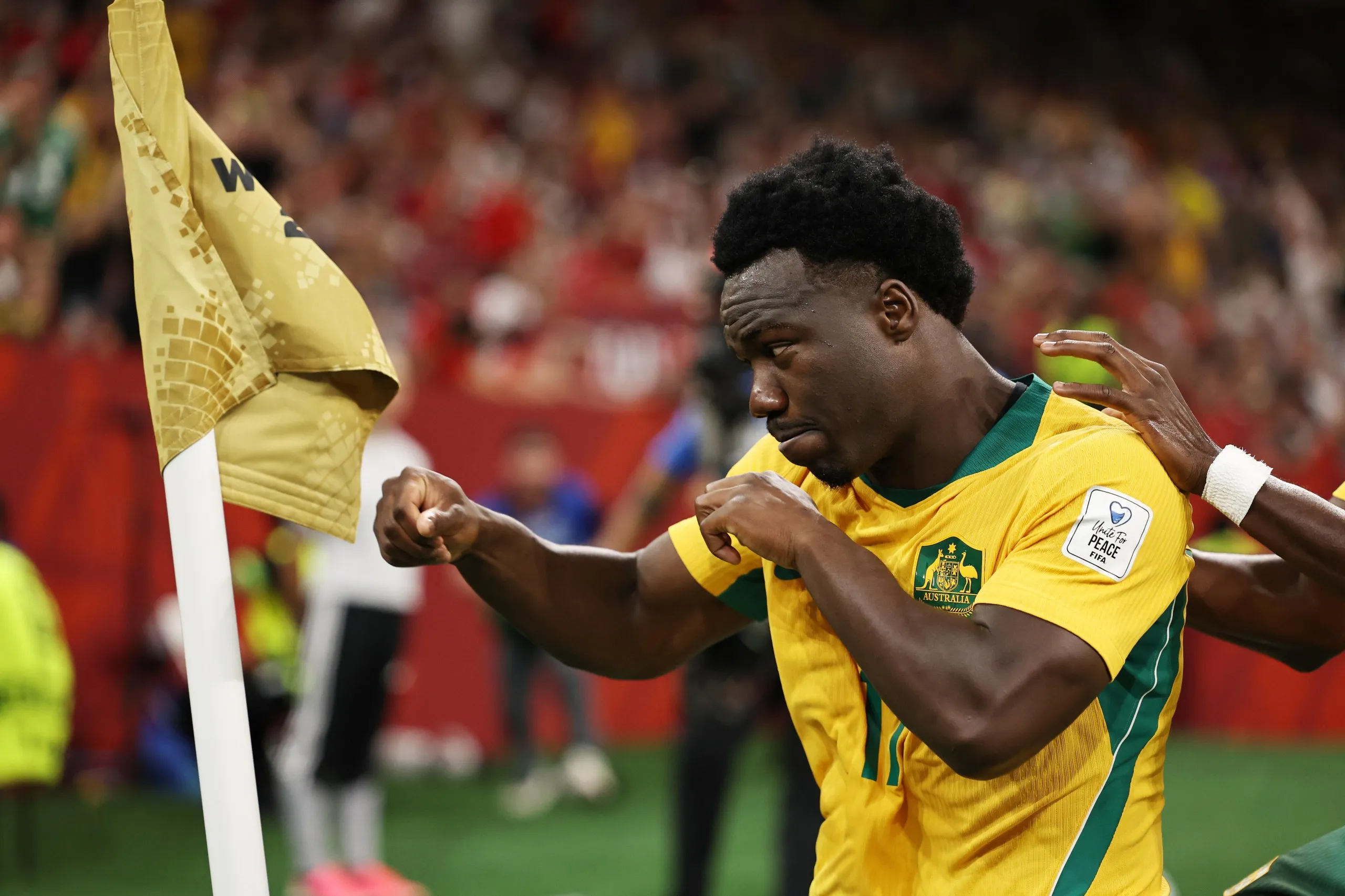 Australia’s Nestory Irankunda throws punches while shadowboxing the corner flag